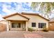 Backyard featuring a covered patio and a low-maintenance desert landscape at 45049 W Cypress Ln, Maricopa, AZ 85139