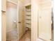 Full bath with a walk-in shower, shelving, and toilet at 45049 W Cypress Ln, Maricopa, AZ 85139