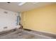 Garage showing the water heater with concrete floor and painted walls at 45049 W Cypress Ln, Maricopa, AZ 85139