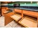 Cherry cabinets with slide out shelves and stainless steel appliances at 45049 W Cypress Ln, Maricopa, AZ 85139