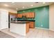 Bright kitchen boasting stainless steel appliances, an island, and ample cabinet space for cooking and storage at 45049 W Cypress Ln, Maricopa, AZ 85139