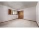 Bright bedroom featuring a window with wood shutters and a large closet at 4621 E Onyx Ave, Phoenix, AZ 85028