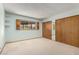 Neutral bedroom features a large mirrored closet, window with shutters, and light blue walls at 4621 E Onyx Ave, Phoenix, AZ 85028