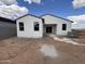 Backyard of newly constructed home with white stucco exterior and potential for outdoor enjoyment at 47733 W Kenner Dr, Maricopa, AZ 85139