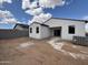 Backyard of newly constructed home with white stucco exterior and potential for outdoor enjoyment at 47733 W Kenner Dr, Maricopa, AZ 85139