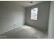 Unfinished bedroom featuring a window offering views of the surrounding construction and neutral walls at 47733 W Kenner Dr, Maricopa, AZ 85139