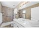 Bright bathroom with a large mirror, double sink, and a clean, modern design, perfect for everyday routines at 48 E Nolana Pl, San Tan Valley, AZ 85143