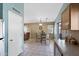Bright dining area with a glass-top table, neutral walls, and views to the kitchen and living areas at 48 E Nolana Pl, San Tan Valley, AZ 85143