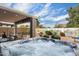 Inviting backyard hot tub with a covered patio and serene landscaping, perfect for relaxation and outdoor living at 48 E Nolana Pl, San Tan Valley, AZ 85143