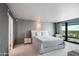 Main bedroom with large bed, bedside table and large windows with city views at 4808 N 24Th St # 908, Phoenix, AZ 85016