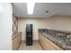 Clean break room equipped with a water cooler and sink at 4808 N 24Th St # 908, Phoenix, AZ 85016