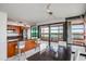 Open dining area with balcony access, seamlessly integrated with a modern kitchen at 4808 N 24Th St # 908, Phoenix, AZ 85016