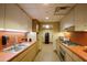 Well-lit kitchen includes stainless steel appliances and ample counter space at 4808 N 24Th St # 908, Phoenix, AZ 85016
