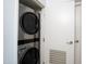 Laundry room with stainless steel stacked washer and dryer at 4808 N 24Th St # 908, Phoenix, AZ 85016