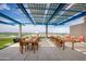 Stylish rooftop terrace with dining tables and outdoor seating at 4808 N 24Th St # 908, Phoenix, AZ 85016
