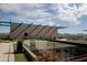 Enjoy the scenic views from this rooftop deck with glass railings, seating, and artificial grass at 4808 N 24Th St # 908, Phoenix, AZ 85016