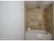Bathroom featuring a shower/tub combination with modern fixtures and white tiles at 4808 N 24Th St # 908, Phoenix, AZ 85016