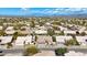 Expansive aerial view of a desert community with mountains in the distance, showcasing single-Gathering homes and desert landscaping at 4944 E Dale Ln, Cave Creek, AZ 85331