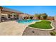 Inviting backyard with travertine pavers, pebble tec pool, artificial grass, and desert landscape at 4944 E Dale Ln, Cave Creek, AZ 85331