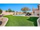 Spacious backyard featuring a pool, artificial grass, and well-maintained landscaping at 4944 E Dale Ln, Cave Creek, AZ 85331