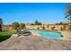 Stunning backyard pool with lounge chairs, travertine pavers, and landscaped backyard at 4944 E Dale Ln, Cave Creek, AZ 85331