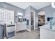 Relaxing bathroom with dual sinks, tiled floors, and a glass block window at 4944 E Dale Ln, Cave Creek, AZ 85331