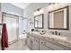 Well-lit bathroom features double sinks and a shower/tub combo with neutral tones at 4944 E Dale Ln, Cave Creek, AZ 85331