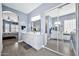 Dual-sink bathroom with mirrored closet doors providing abundant storage at 4944 E Dale Ln, Cave Creek, AZ 85331