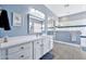 Bright bathroom featuring white cabinetry, quartz counters, and a tiled walk-in shower at 4944 E Dale Ln, Cave Creek, AZ 85331