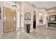 Inviting entryway with tiled floors, a decorative plant, and an archway leading to other rooms at 4944 E Dale Ln, Cave Creek, AZ 85331