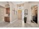 Open entryway featuring tile floors, arched ceilings, and views to the laundry and another room at 4944 E Dale Ln, Cave Creek, AZ 85331