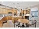 Bright kitchen features wooden cabinets, granite countertops, stainless appliances, and a breakfast table with chairs at 4944 E Dale Ln, Cave Creek, AZ 85331
