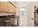 Well-equipped laundry area with cabinets, providing ample storage and convenience at 4944 E Dale Ln, Cave Creek, AZ 85331