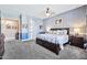 Comfortable main bedroom boasts blue walls, a ceiling fan, and plush carpeting at 4944 E Dale Ln, Cave Creek, AZ 85331