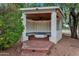 Gazebo with vaulted ceiling and fan overlooking seating area and fire pit, perfect for evening relaxation at 576 W Moon Valley Dr, Phoenix, AZ 85023
