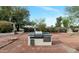 Outdoor kitchen with built-in grill, tile countertop, and storage, perfect for backyard entertaining at 576 W Moon Valley Dr, Phoenix, AZ 85023