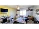 This bedroom features posters, window, ceiling fan and wardrobe at 5924 W Running Deer Trl, Phoenix, AZ 85083