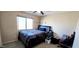 Neutral bedroom with large window and ceiling fan at 5924 W Running Deer Trl, Phoenix, AZ 85083