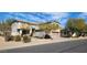 Inviting two-story home with desert landscaping, featuring a convenient two-car garage and covered porch at 5924 W Running Deer Trl, Phoenix, AZ 85083