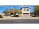 Charming two-story home featuring a two-car garage, desert landscaping, and an inviting covered porch at 5924 W Running Deer Trl, Phoenix, AZ 85083