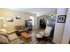 Inviting living room with ample seating, wood floors, and access to adjacent rooms, perfect for entertaining at 5924 W Running Deer Trl, Phoenix, AZ 85083