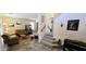 Comfortable living room with neutral tones, tile floors, and a staircase leading to the upper level at 5924 W Running Deer Trl, Phoenix, AZ 85083