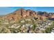 Scenic aerial view of a luxurious residential community nestled amidst the stunning desert mountain landscape at 5935 N Echo Canyon Ln, Phoenix, AZ 85018