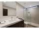 Bright bathroom with a modern vanity and a glass-enclosed shower at 5935 N Echo Canyon Ln, Phoenix, AZ 85018