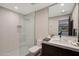 Contemporary bathroom featuring a walk-in shower with tiled walls at 5935 N Echo Canyon Ln, Phoenix, AZ 85018