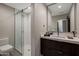 Modern bathroom featuring sleek fixtures and a glass-enclosed shower at 5935 N Echo Canyon Ln, Phoenix, AZ 85018