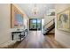 Grand foyer features modern artwork, staircase, and natural light, offering a welcoming entrance at 5935 N Echo Canyon Ln, Phoenix, AZ 85018