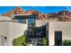 Contemporary home with a well-manicured garden, modern architectural details, and breathtaking mountain views at 5935 N Echo Canyon Ln, Phoenix, AZ 85018