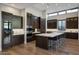 Gourmet kitchen with a large island, top-of-the-line appliances, and custom cabinetry at 5935 N Echo Canyon Ln, Phoenix, AZ 85018