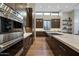 Modern kitchen with stainless steel appliances, custom cabinetry, and ample counter space at 5935 N Echo Canyon Ln, Phoenix, AZ 85018